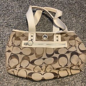 tan coach bag with silver accents